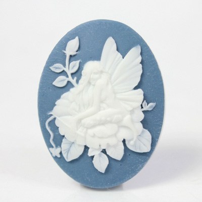 Plastic Cameo - Fairy on Flower Oval 40x30MM WHITE ON ROYAL BLUE