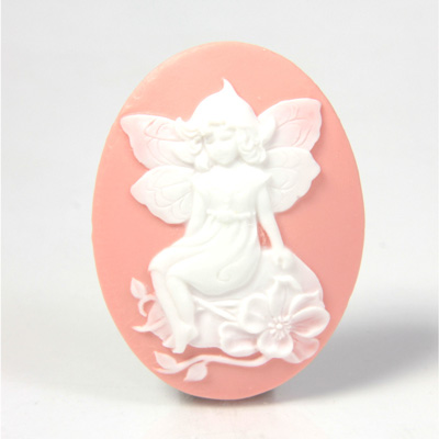 Plastic Cameo - Fairy Sitting on Garden Stone Oval 40x30MM WHITE ON PINK